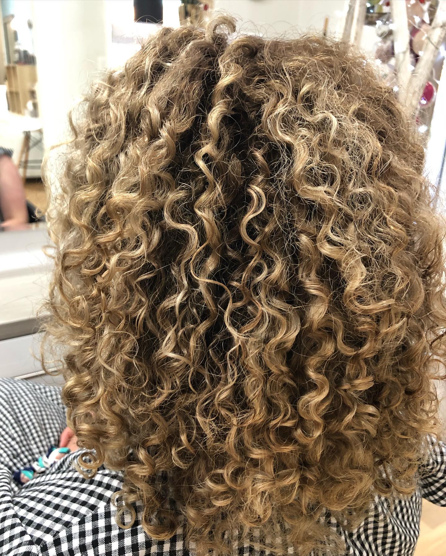 Close-up of healthy, defined curls showing natural texture and shine